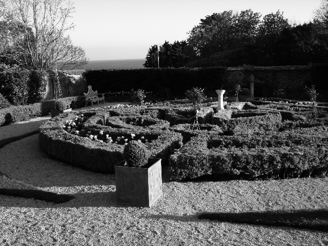 Rosteague’s formal box parterres are protected from the sea  winds by a wall of cob 