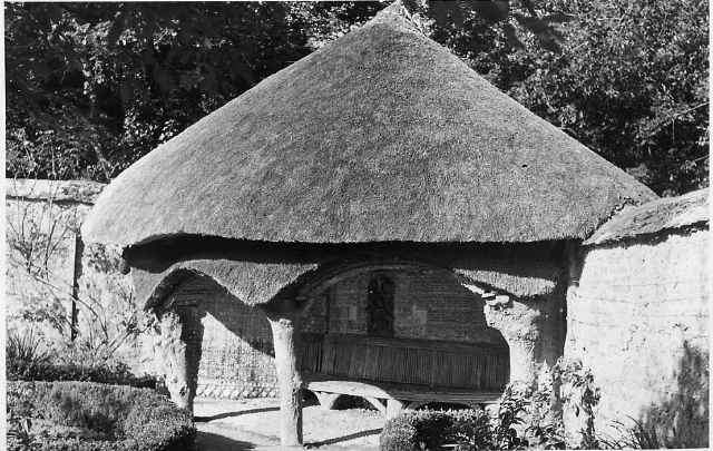 A postcard of the thatched summer-house in the French Garden, c.1912